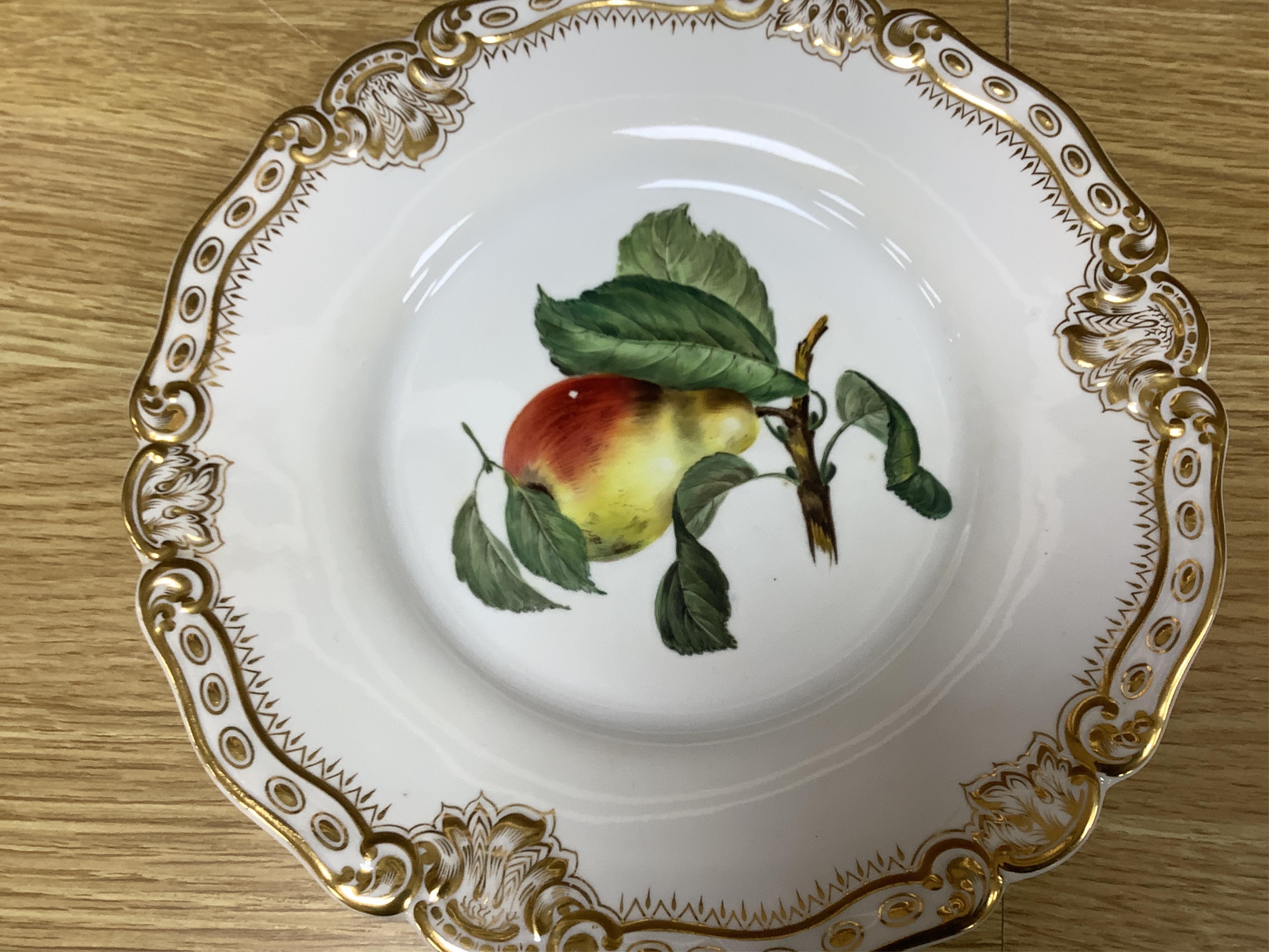 A late 19th century Worcester dessert service hand painted with fruit, largest 30cm wide. Condition - mostly good